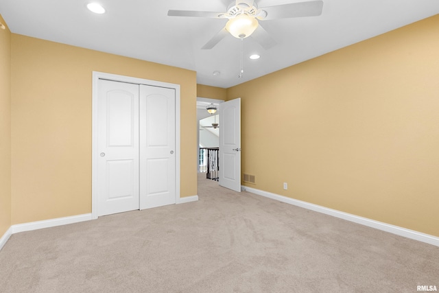 4851 Sheridan Rd, Groveland, IL 61535 - unfurnished bedroom with light colored carpet, recessed lighting, a closet, and ceiling fan