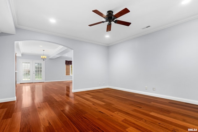 4851 Sheridan Rd, Groveland, IL 61535 - unfurnished room with arched walkways, wood finished floors, ceiling fan, ornamental molding, and a chandelier