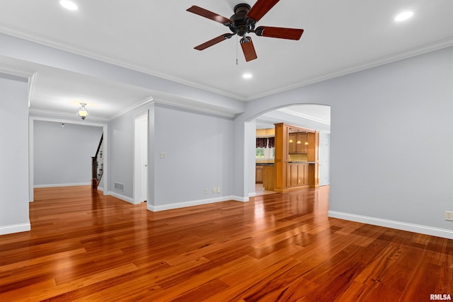 4851 Sheridan Rd, Groveland, IL 61535 - unfurnished room featuring arched walkways, a ceiling fan, wood finished floors, crown molding, and recessed lighting