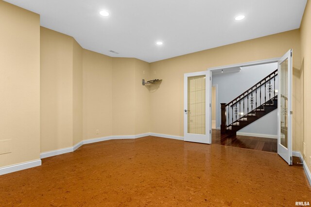4851 Sheridan Rd, Groveland, IL 61535 - empty room featuring french doors, recessed lighting, and stairway