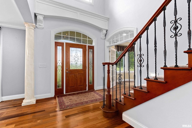 4851 Sheridan Rd, Groveland, IL 61535 - entrance foyer with wood finished floors, healthy amount of natural light, decorative columns, and a high ceiling