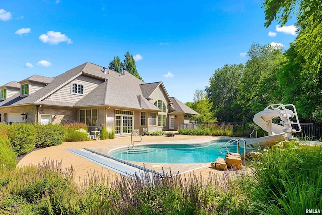 4851 Sheridan Rd, Groveland, IL 61535 - view of pool with a water slide and a patio