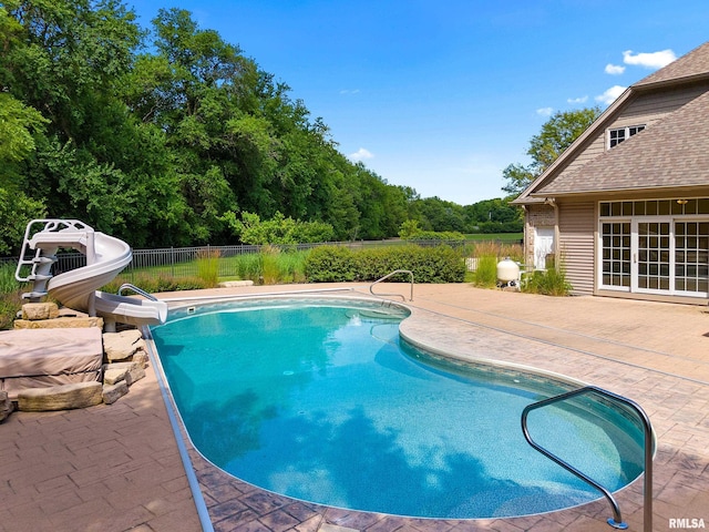 4851 Sheridan Rd, Groveland, IL 61535 - view of pool featuring a water slide and a patio