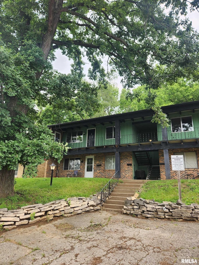 740 E Shore Dr Unit 8, Pekin, IL 61554 - townhome / multi-family property featuring stairway and a front yard
