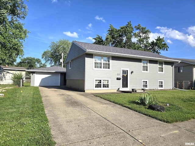 1704 Heisel Ave, Pekin, IL 61554 - bi-level home featuring a garage and driveway