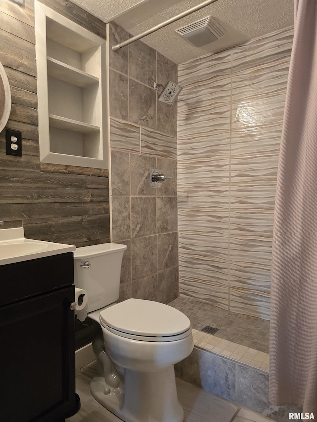 1704 Heisel Ave, Pekin, IL 61554 - full bath with a stall shower, a textured ceiling, vanity, and tile walls