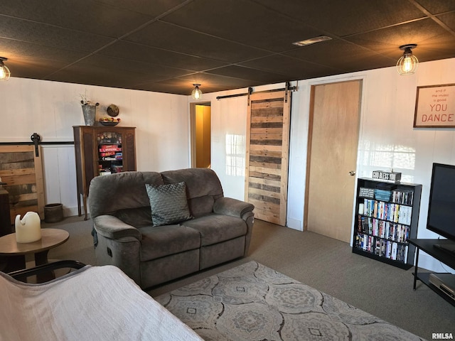 1704 Heisel Ave, Pekin, IL 61554 - carpeted living room featuring a barn door and a drop ceiling