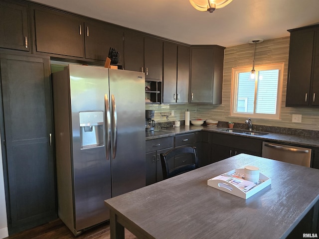 1704 Heisel Ave, Pekin, IL 61554 - kitchen featuring dark countertops, stainless steel appliances, decorative light fixtures, and dark brown cabinets