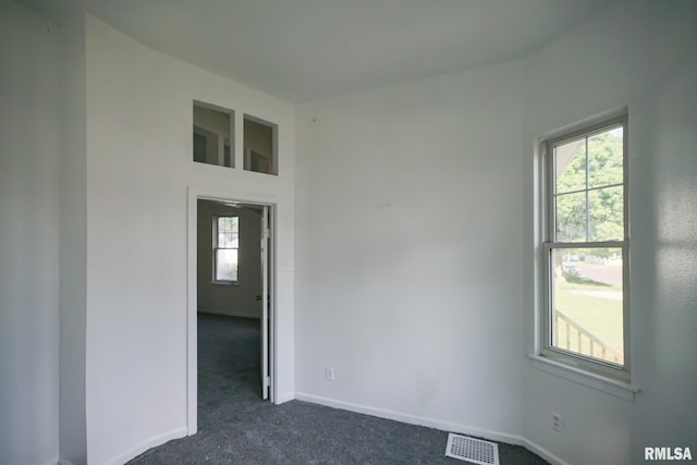 1107 E Frye Ave, Peoria, IL 61603 - unfurnished room with dark colored carpet and baseboards