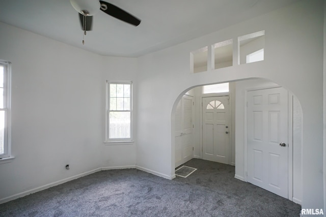 1107 E Frye Ave, Peoria, IL 61603 - foyer with arched walkways, carpet floors, and ceiling fan