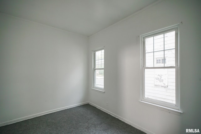 1107 E Frye Ave, Peoria, IL 61603 - spare room with dark carpet and baseboards