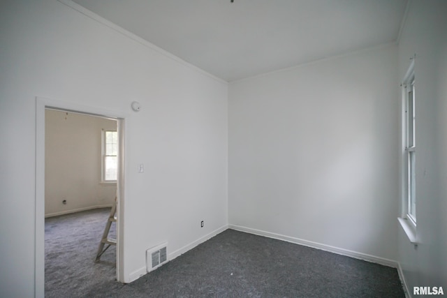 1107 E Frye Ave, Peoria, IL 61603 - empty room featuring dark colored carpet, ornamental molding, and a smoke detector