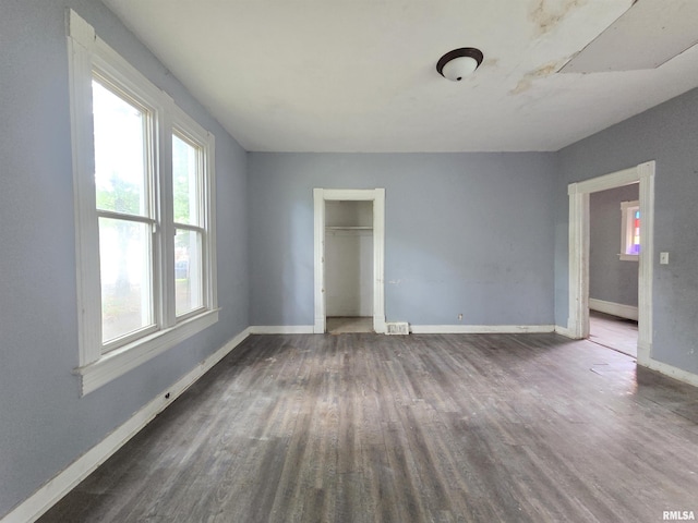 2011 N Bigelow St, Peoria, IL 61604 - unfurnished bedroom featuring wood finished floors and a closet