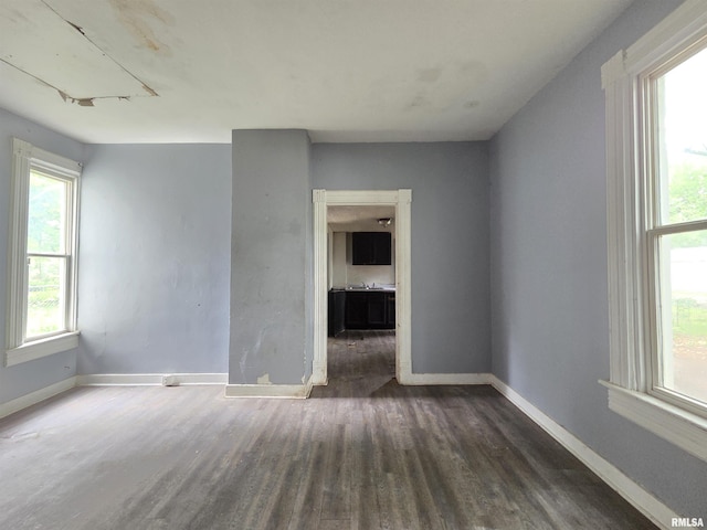 2011 N Bigelow St, Peoria, IL 61604 - spare room with wood finished floors and baseboards