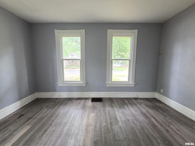 2011 N Bigelow St, Peoria, IL 61604 - empty room with plenty of natural light and wood finished floors