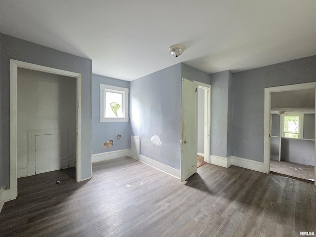 2011 N Bigelow St, Peoria, IL 61604 - unfurnished bedroom featuring wood finished floors