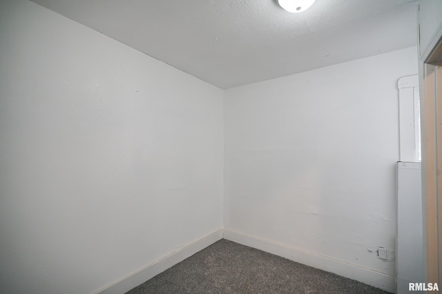 2320 W Krause Ave, Peoria, IL 61605 - spare room with dark colored carpet and baseboards