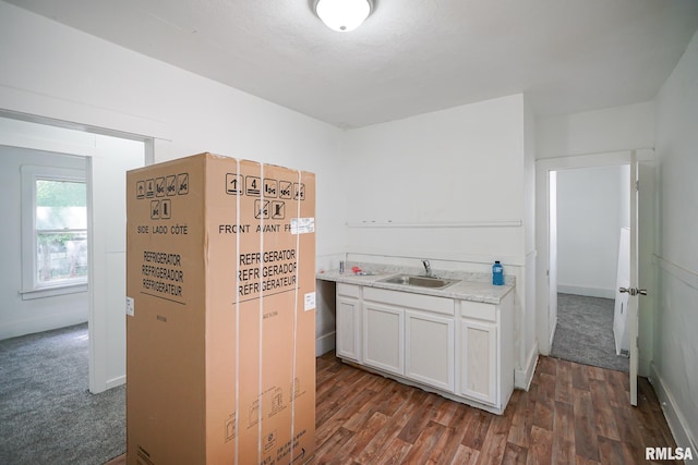 2320 W Krause Ave, Peoria, IL 61605 - kitchen featuring light countertops, dark wood finished floors, and white cabinets