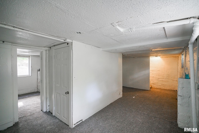 2320 W Krause Ave, Peoria, IL 61605 - basement with a textured ceiling and carpet
