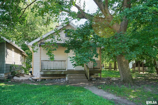 2320 W Krause Ave, Peoria, IL 61605 - obstructed view of property featuring a wooden deck and a front yard