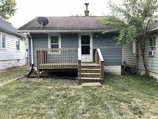 909 W Mcclure Ave, Peoria, IL 61604 - back of house with a yard, a shingled roof, and a wooden deck