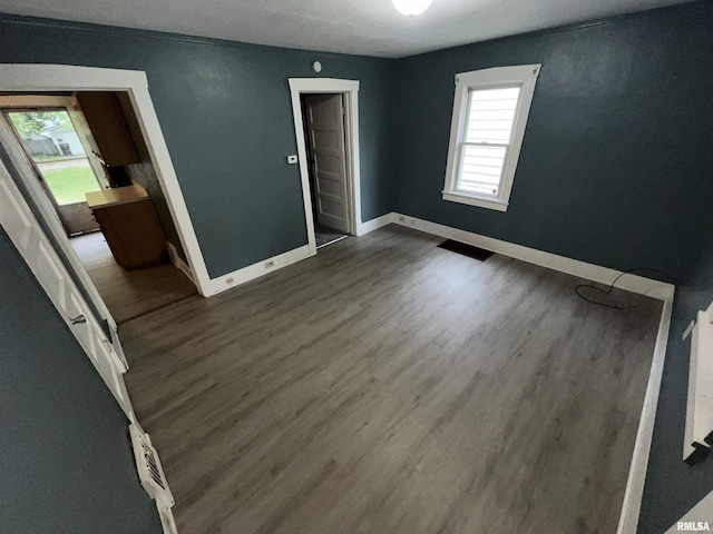 909 W Mcclure Ave, Peoria, IL 61604 - unfurnished room featuring dark wood finished floors
