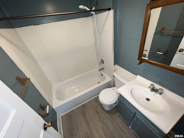 909 W Mcclure Ave, Peoria, IL 61604 - full bathroom featuring bathtub / shower combination, wood finished floors, and vanity