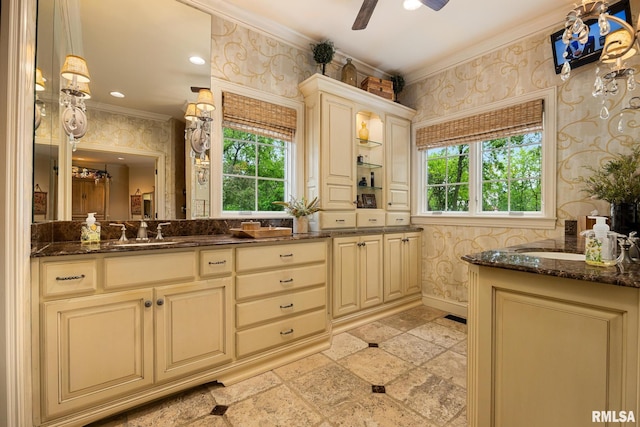 2204 W Pinnacle Dr, Dunlap, IL 61525 - bathroom featuring wallpapered walls, ornamental molding, double vanity, healthy amount of natural light, and a ceiling fan