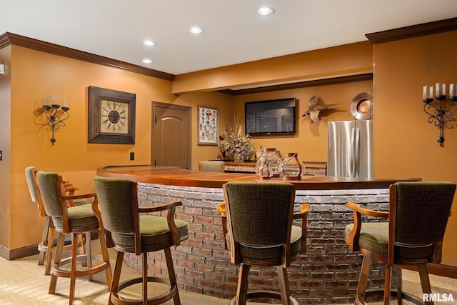 2204 W Pinnacle Dr, Dunlap, IL 61525 - indoor wet bar with freestanding refrigerator, carpet floors, recessed lighting, and crown molding