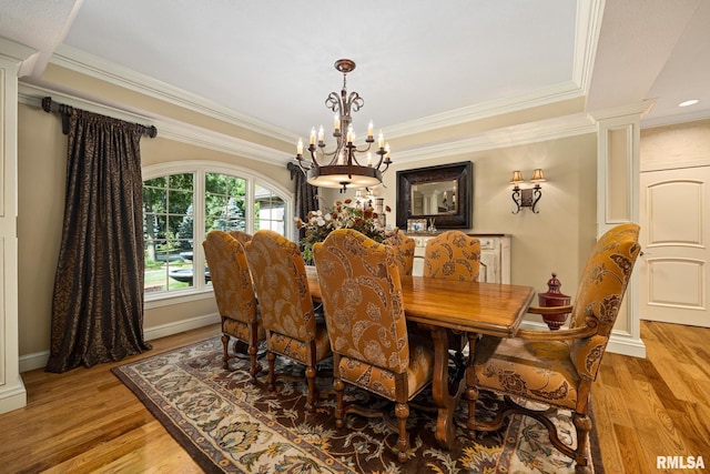 2204 W Pinnacle Dr, Dunlap, IL 61525 - dining room featuring a chandelier, crown molding, light wood finished floors, recessed lighting, and decorative columns