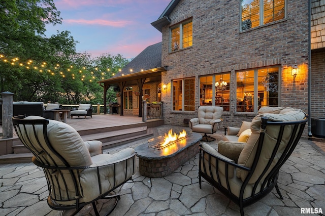 2204 W Pinnacle Dr, Dunlap, IL 61525 - view of patio with an outdoor living space with a fire pit, a deck, and area for grilling
