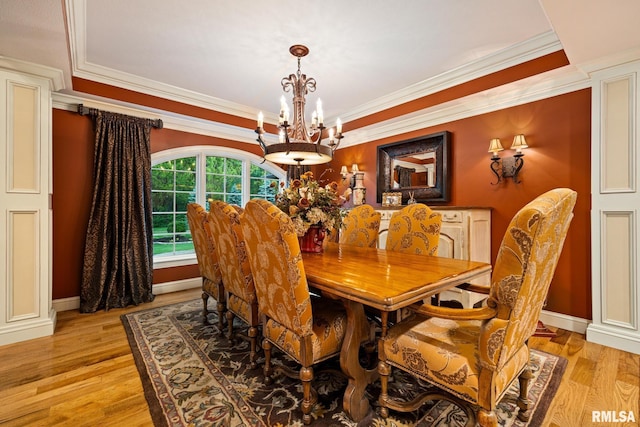 2204 W Pinnacle Dr, Dunlap, IL 61525 - dining space with a chandelier, crown molding, and light wood-style floors