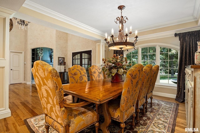 2204 W Pinnacle Dr, Dunlap, IL 61525 - dining room featuring a chandelier, ornamental molding, and light wood-style flooring