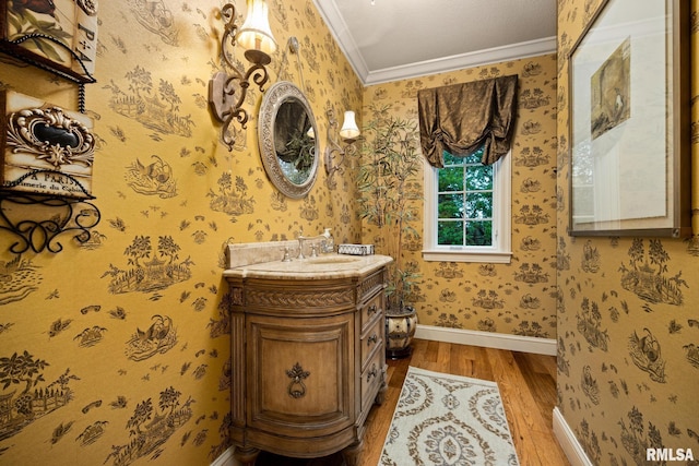 2204 W Pinnacle Dr, Dunlap, IL 61525 - bathroom with wood finished floors, ornamental molding, vanity, and wallpapered walls