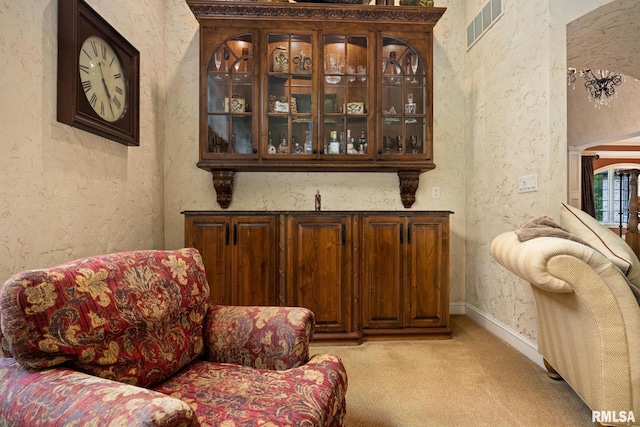2204 W Pinnacle Dr, Dunlap, IL 61525 - bar area featuring a textured wall and light colored carpet