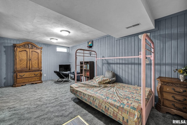 2816 N Kingston Dr, Peoria, IL 61604 - bedroom featuring carpet floors, wood walls, and a textured ceiling