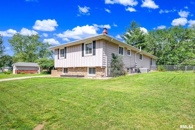 2816 N Kingston Dr, Peoria, IL 61604 - view of home's exterior featuring a chimney and a central air condition unit