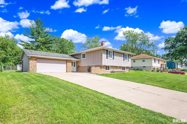2816 N Kingston Dr, Peoria, IL 61604 - split level home with brick siding, board and batten siding, concrete driveway, and an attached garage