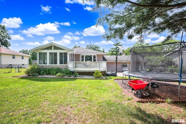 2816 N Kingston Dr, Peoria, IL 61604 - back of house with a trampoline, a deck, and a sunroom