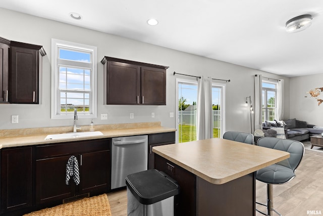 1604 Savile Ln, Washington, IL 61571 - kitchen featuring stainless steel dishwasher, open floor plan, light wood finished floors, a kitchen breakfast bar, and a kitchen island