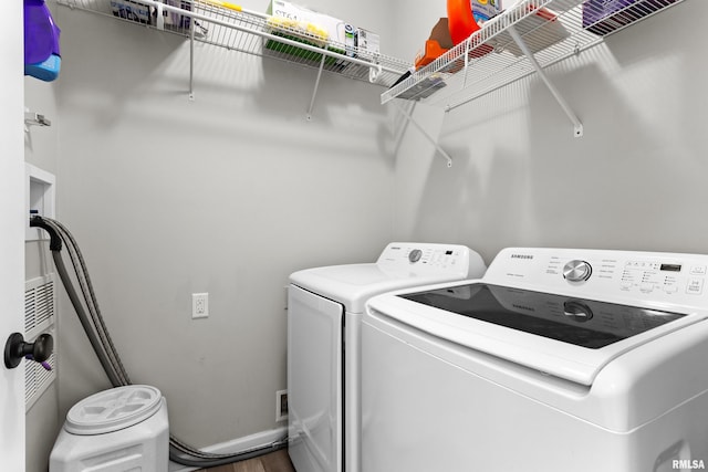 1604 Savile Ln, Washington, IL 61571 - laundry room with separate washer and dryer and wood finished floors