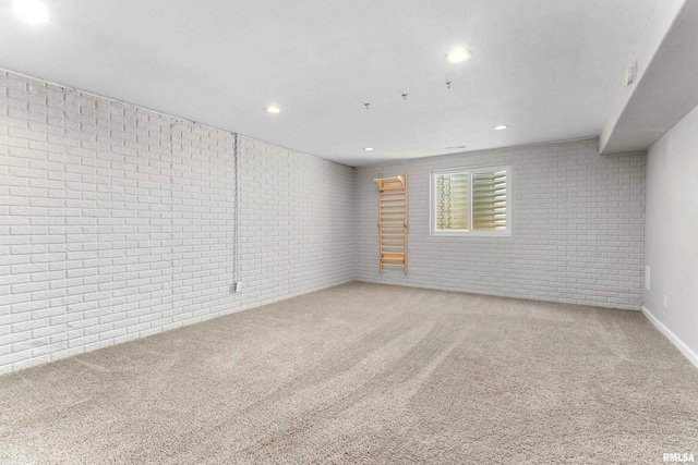 1604 Savile Ln, Washington, IL 61571 - carpeted spare room with brick wall and recessed lighting