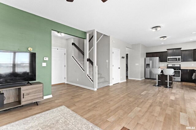 1604 Savile Ln, Washington, IL 61571 - living area featuring light wood-type flooring, stairway, ceiling fan, and recessed lighting
