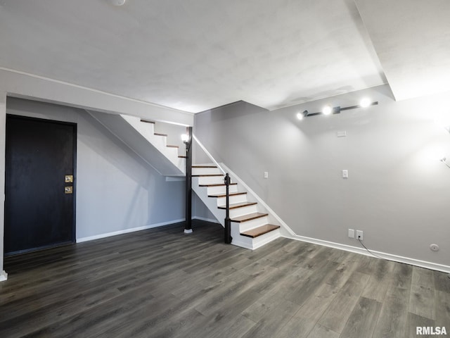 3119 W Willow Knolls Rd Unit 37B, Peoria, IL 61614 - below grade area with stairway and dark wood-style flooring