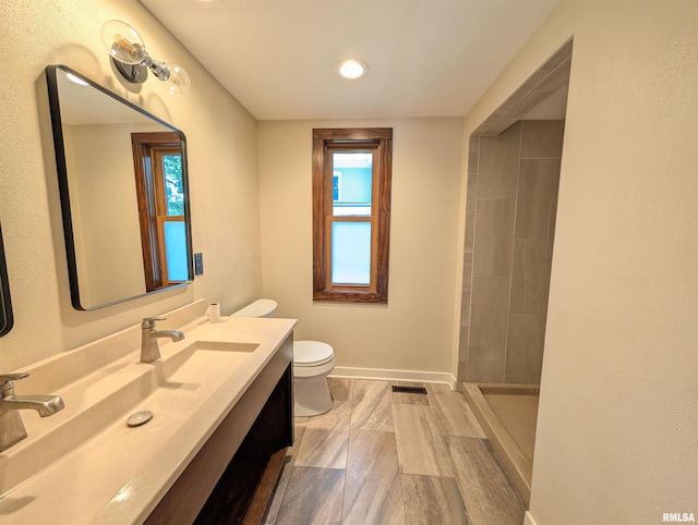 1101 S 4th St, Pekin, IL 61554 - bathroom with vanity, tiled shower, and recessed lighting