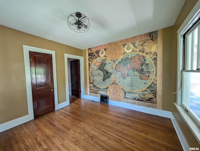 1101 S 4th St, Pekin, IL 61554 - empty room featuring baseboards and wood finished floors
