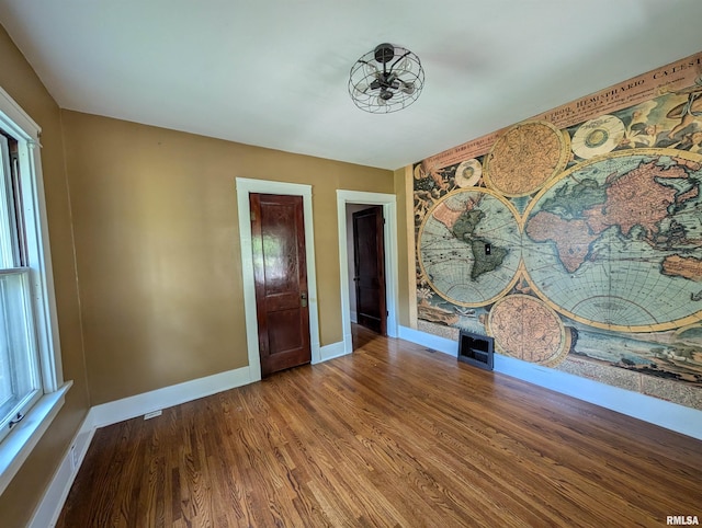 1101 S 4th St, Pekin, IL 61554 - spare room with wood finished floors and healthy amount of natural light