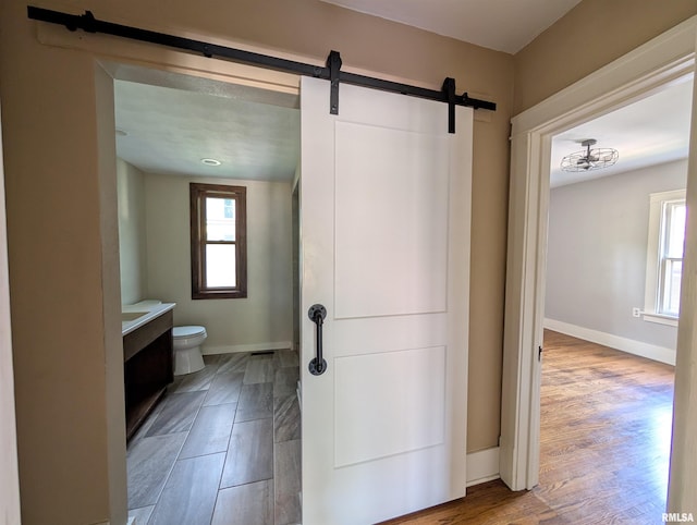 1101 S 4th St, Pekin, IL 61554 - bathroom with healthy amount of natural light, wood finished floors, and vanity