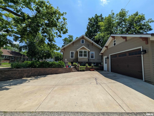 1101 S 4th St, Pekin, IL 61554 - view of front facade with driveway and a garage