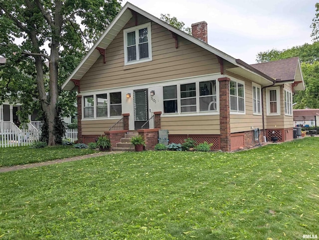 1101 S 4th St, Pekin, IL 61554 - bungalow with a chimney and a front lawn